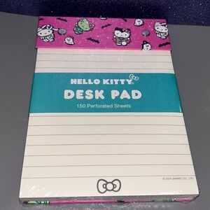 Hello Kitty in Halloween Costumes Desk Pad with perforated sheets